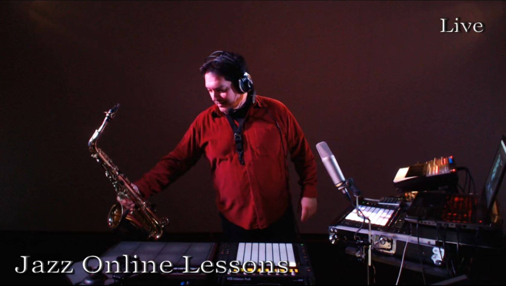 Andreas in a red shirt with alto saxophone, Ableton Push and live rig, during a Jazz Online Lessons stream